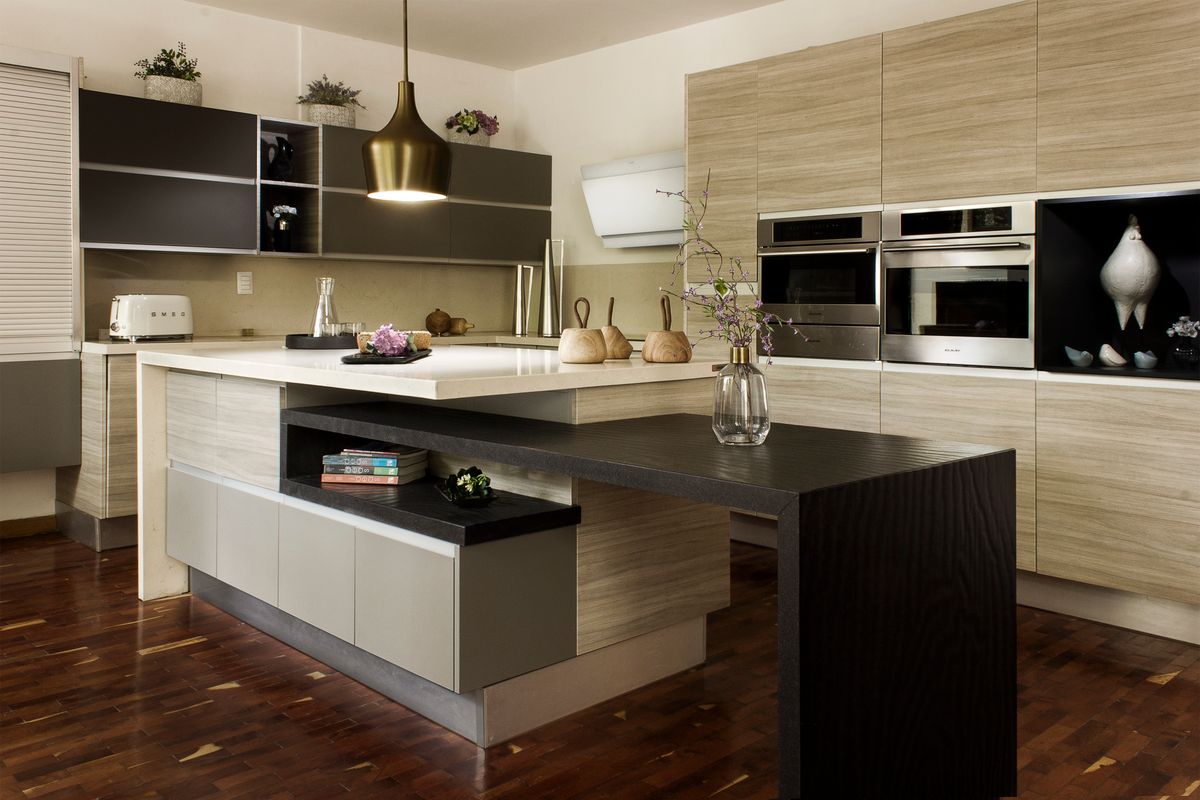 A contemporary kitchen with wooden fronts and an island